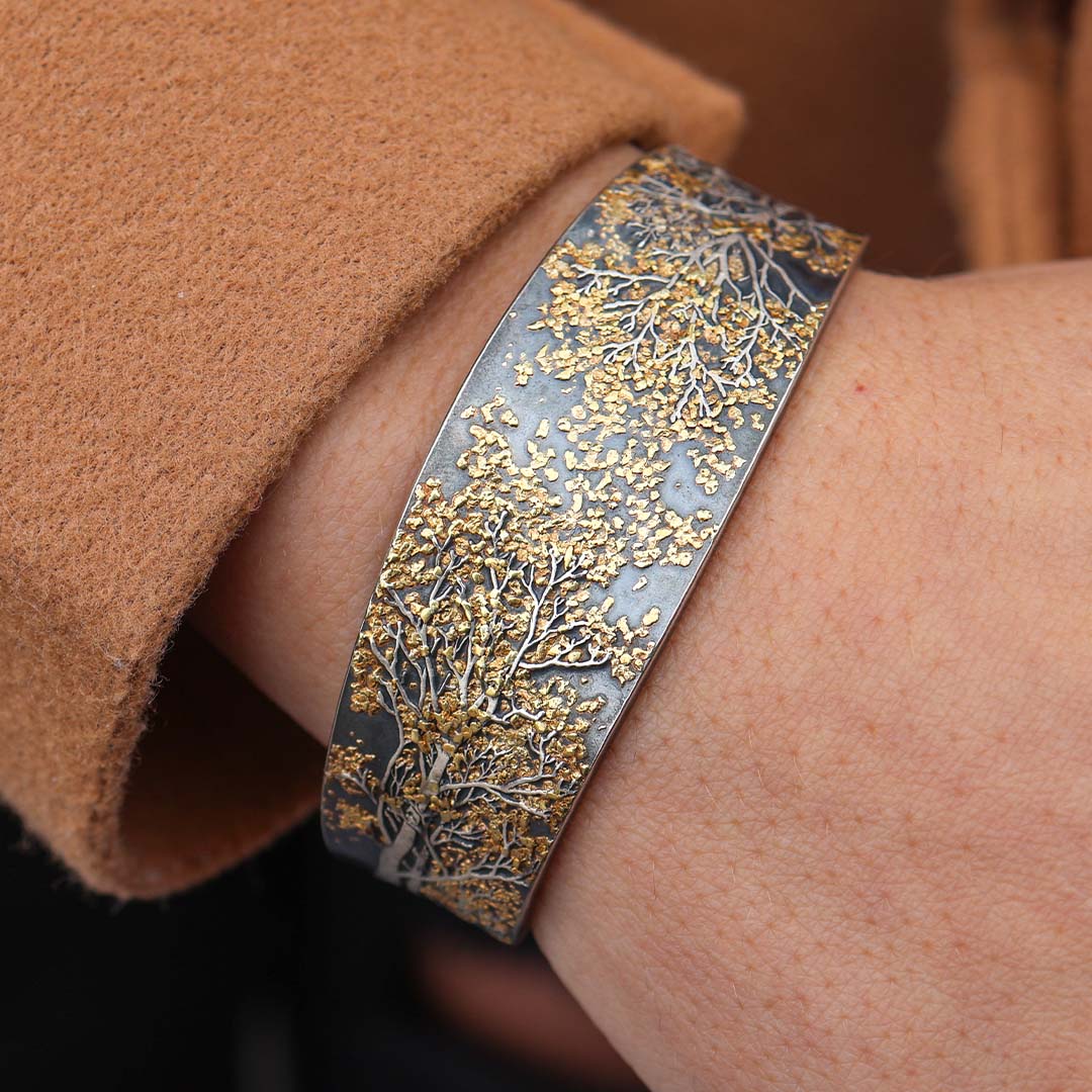 Woman Wearing Sterling Silver and Gold Nugget Aspen Inspired Bracelet Designed by Wolfgang Vaatz