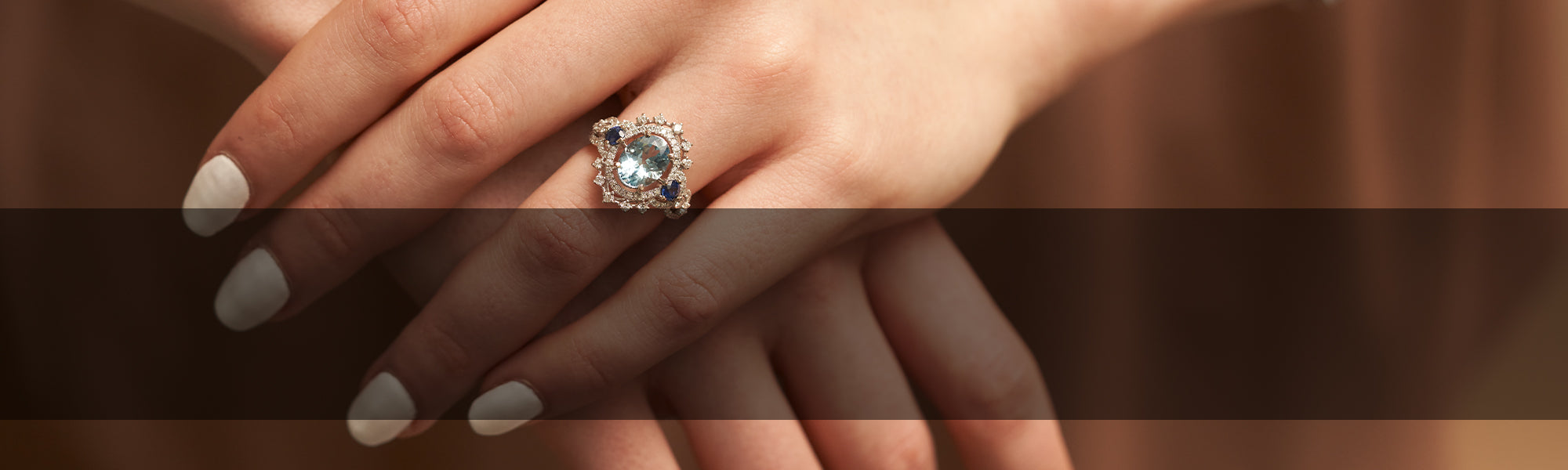 Woman Wearing Aquamarine Ring by Park City Jewelers