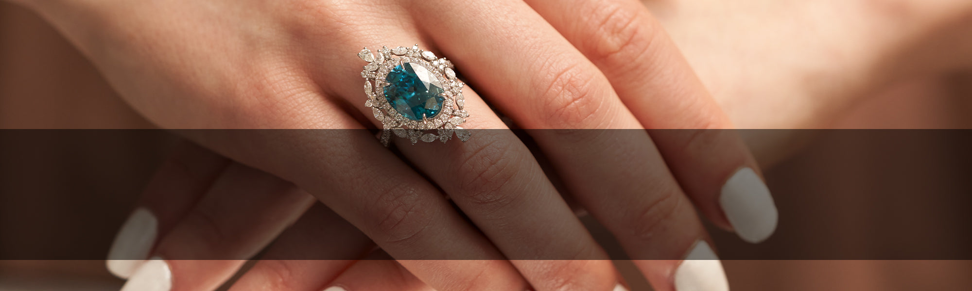 Woman Wearing Blue Zircon Ring by Park City Jewelers