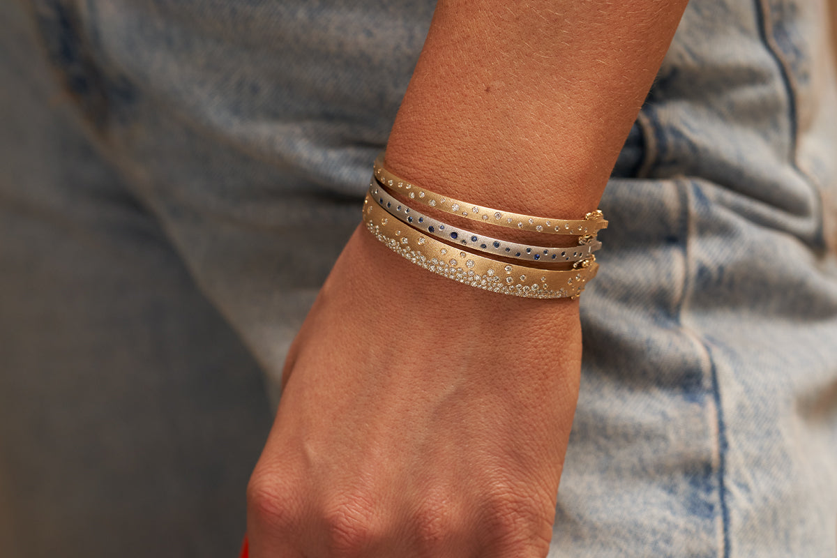 Woman Wearing Three 14K Gold Confetti Bracelets from Park City Jewelers