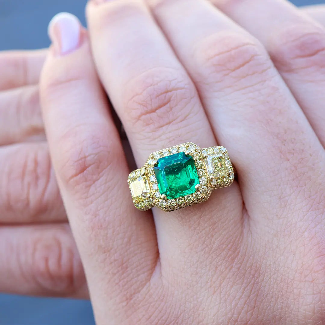 Woman Wearing an Emerald Ring from Park City Jewelers.