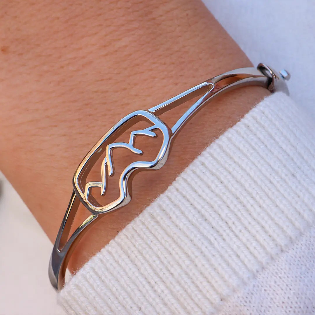 Woman Wearing Sterling Silver Goggles Bracelet by Park City Jewelers.