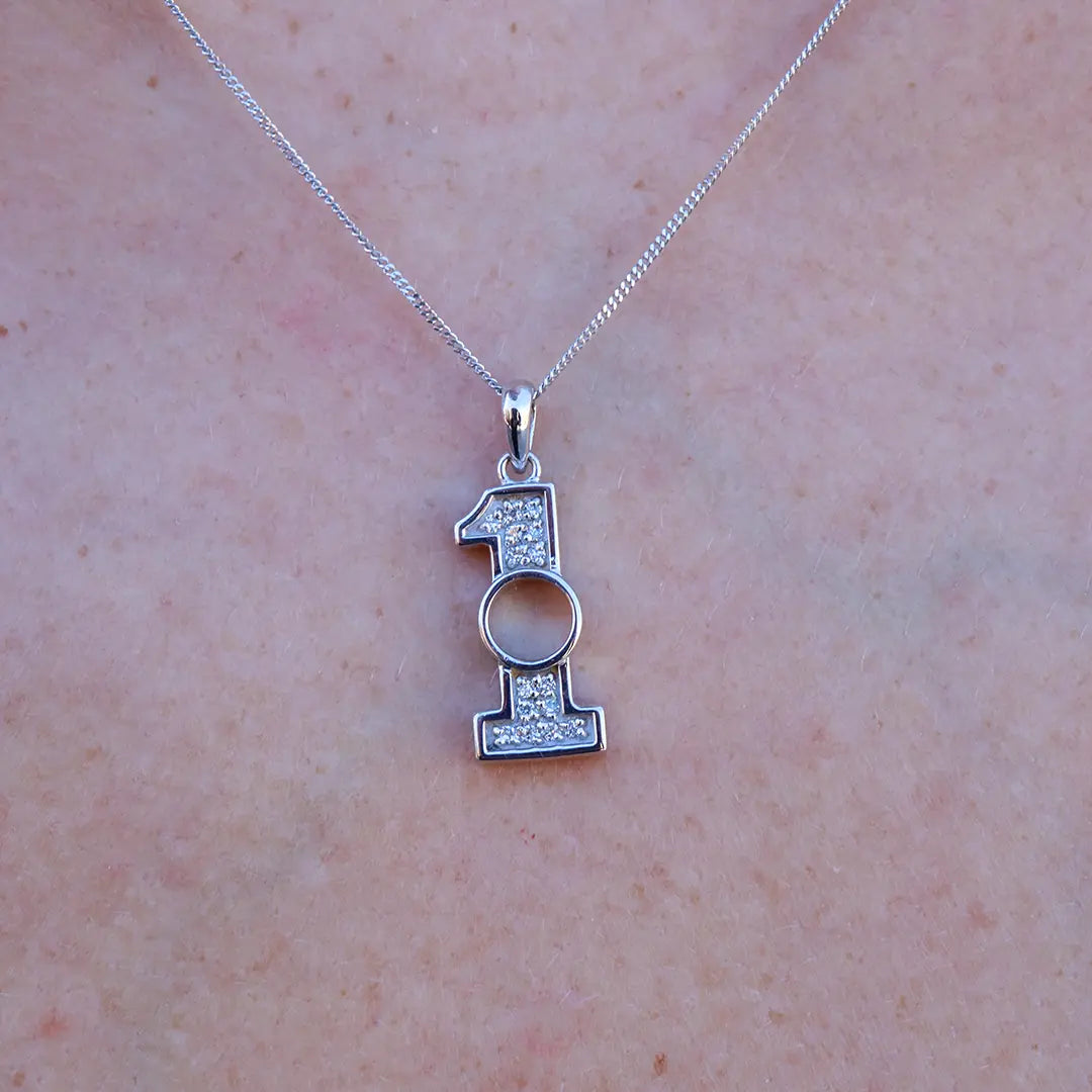 Woman Wearing a Hole-In-One Golf Charm - Park City Jewelers.