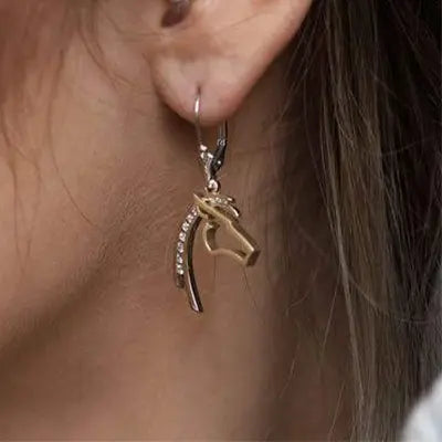 Woman Wearing Horse Head Silhouette Earrings by Park City Jewelers.