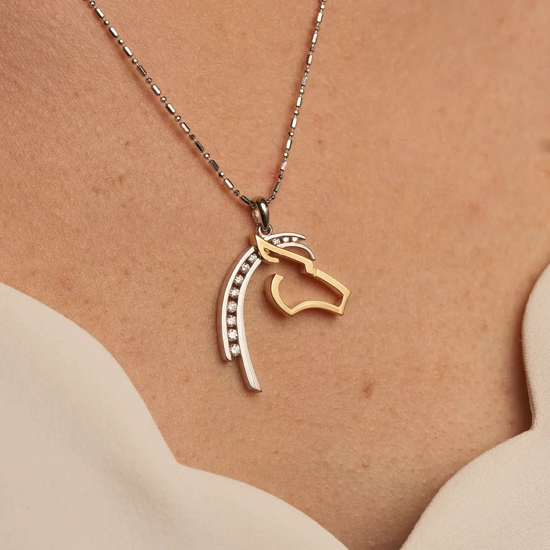 Woman Wearing a Horse Head Silhouette Diamond Pendant - Park City Jewelers