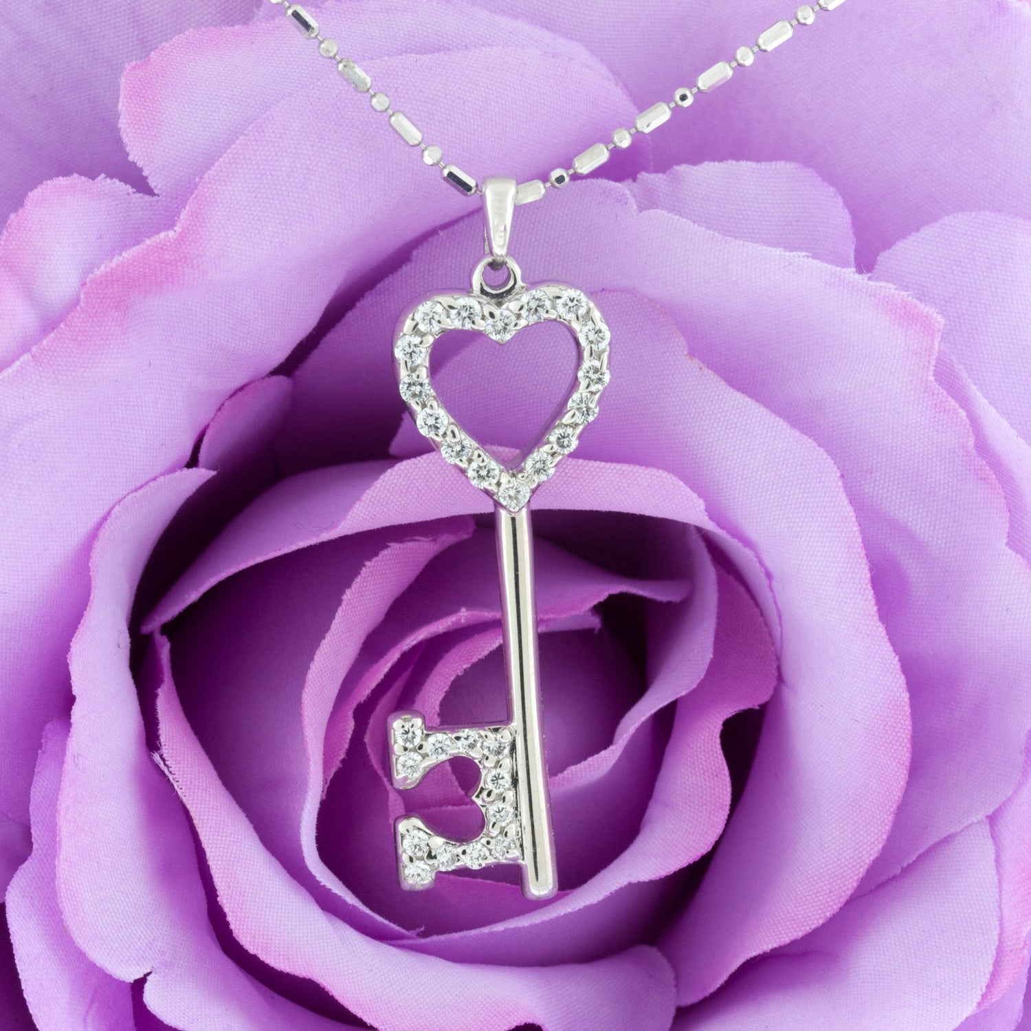 White gold and diamond heart key necklace - Park City Jewelers.