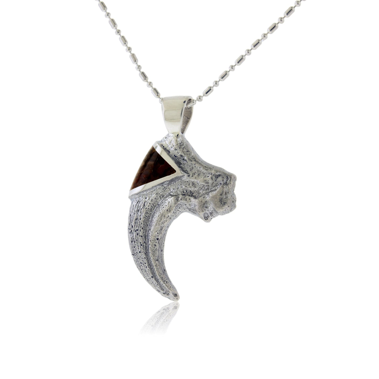 A sterling silver T-Rex claw pendant with a rugged, textured finish, featuring a triangular inlay of reddish-brown dinosaur bone at the top.