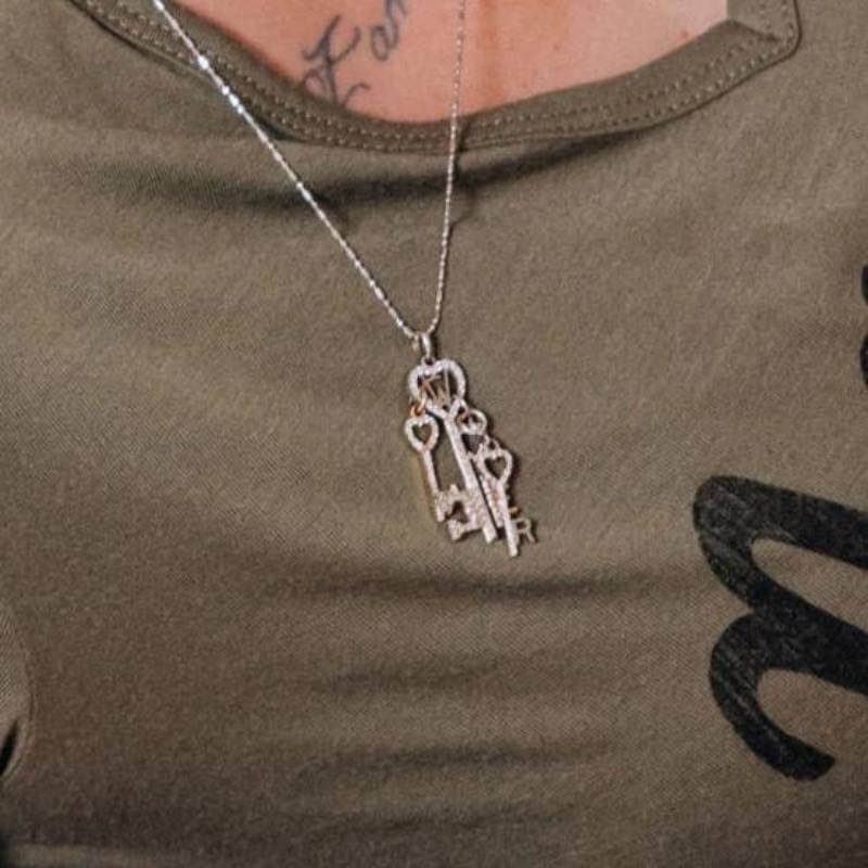 Mother wearing key mother's necklace - Park City Jewelers.