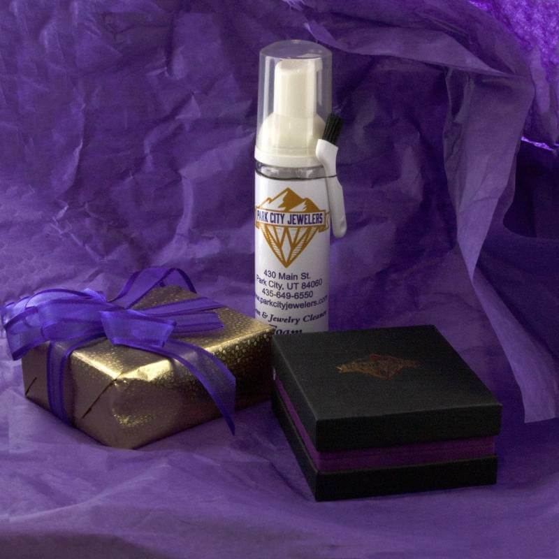 Park City Jewelers jewelry cleaner, jewelry box, and gift wrapped box