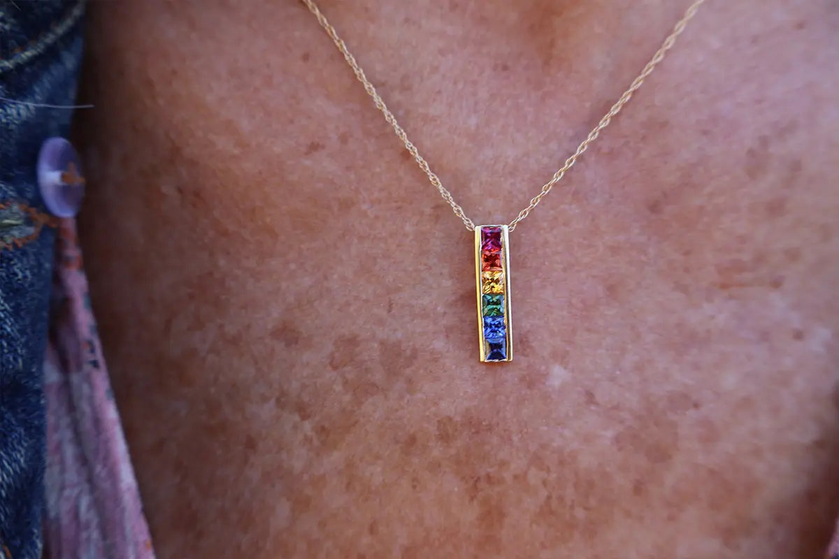 Woman Wearing Rainbow Sapphire Pendant from Park City Jewelers
