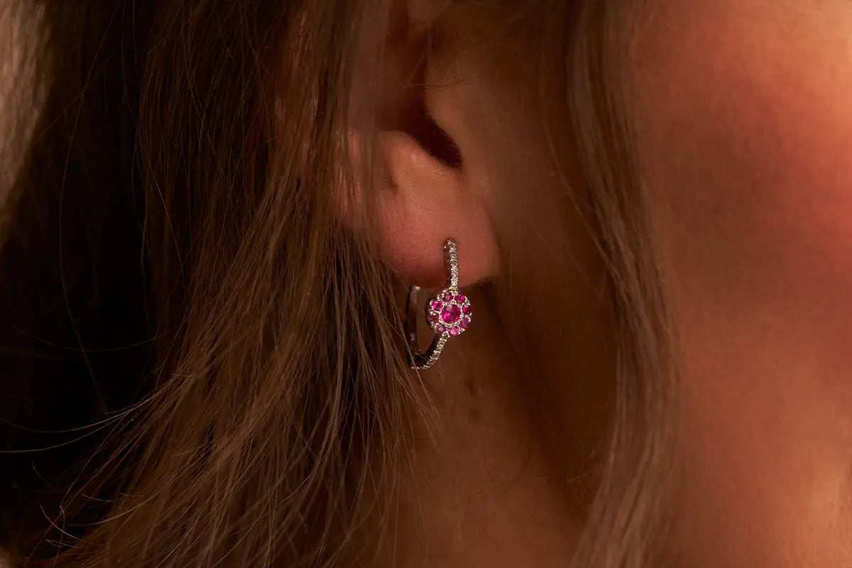 Woman Wearing Ruby Cluster Earrings from Park City Jewelers