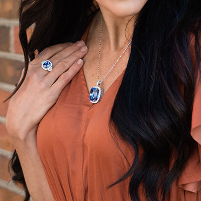 Woman wearing Park City Jewelers tanzanite necklace and ring