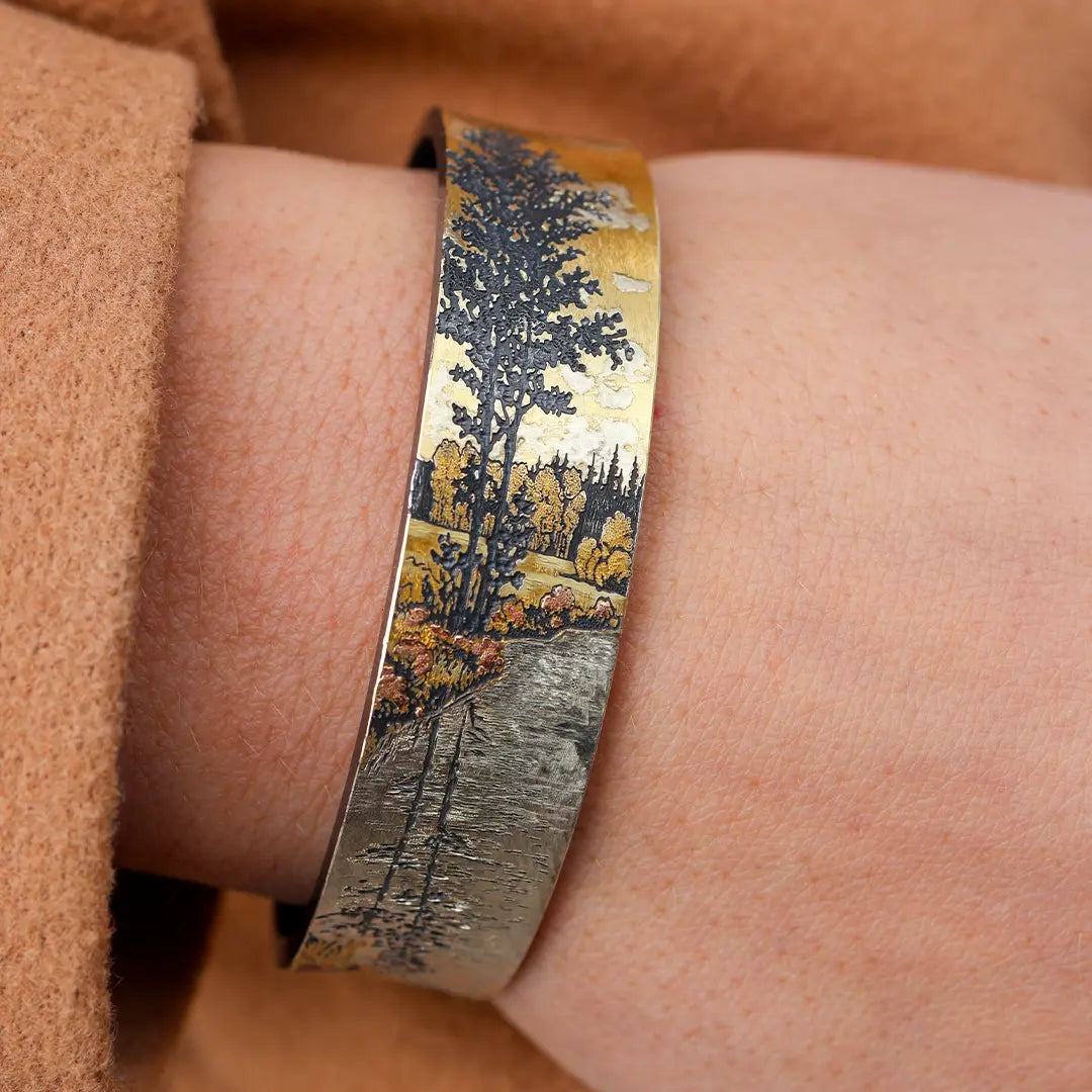 Woman Wearing Wolfgang Vaatz Mountain Scene Bracelet - Park City Jewelers