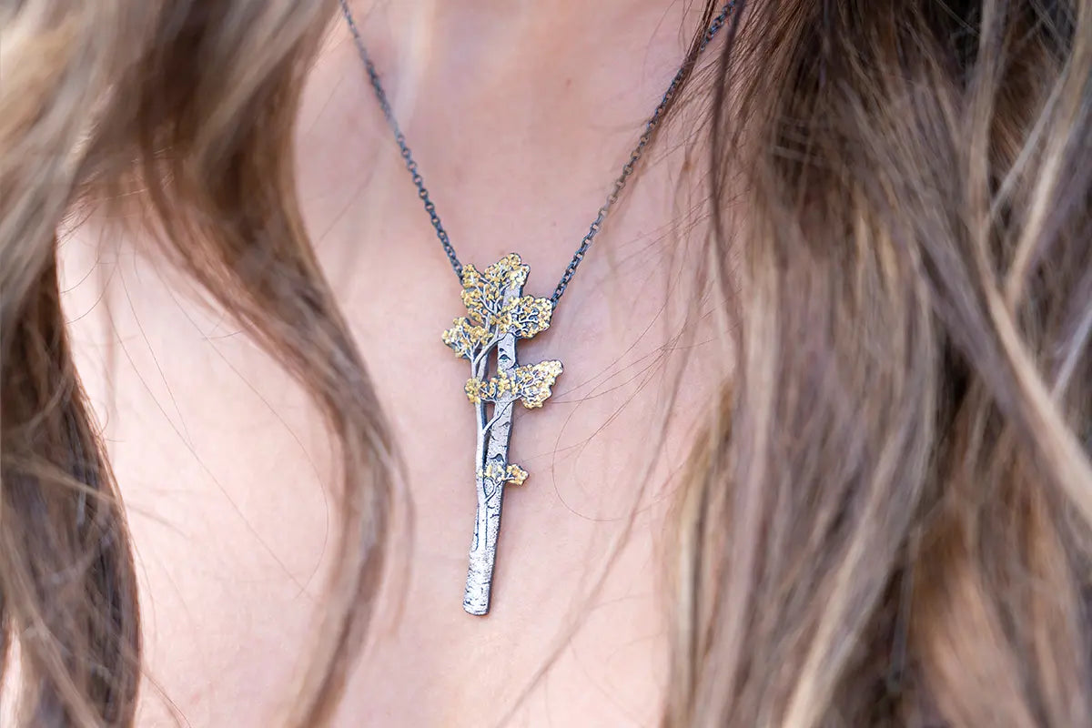 Woman Wearing Wolfgang Vaatz Aspen Inspired Pendant from Park City Jewelers