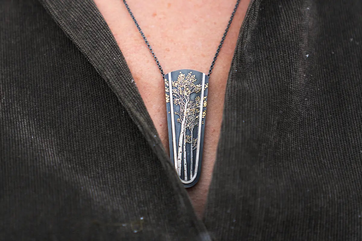 Woman Wearing Wolfgang Vaatz Aspen Inspired Pendant with Natural Gold Nuggets from Park City Jewelers