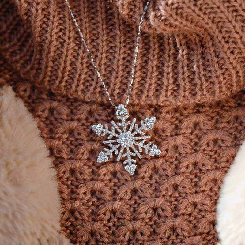 Woman wearing diamond snowflake necklace