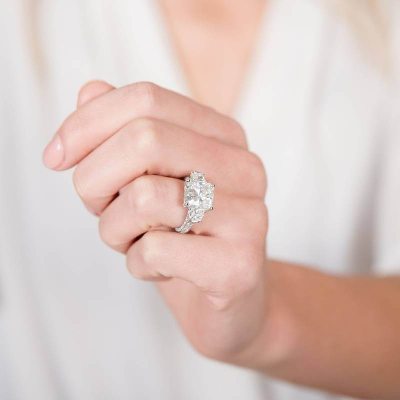 Woman-wearing-large-princess-cut-diamond-engagement-ring