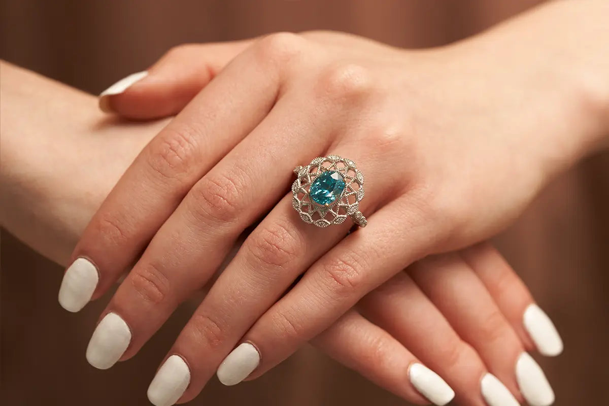 Woman Wearing a Blue Zircon Ring from Park City Jewelers.