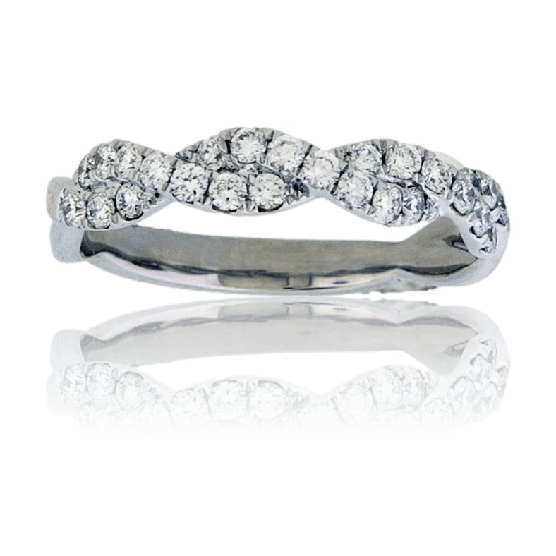 Top-down view of a diamond criss-cross ring, showing the two intertwined bands, one paved with diamonds and one of high-polish white gold.