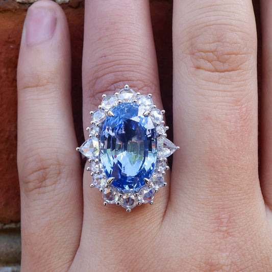 Large Oval Blue Sapphire with Round and Diamond Halo Style Ring - Park City Jewelers
