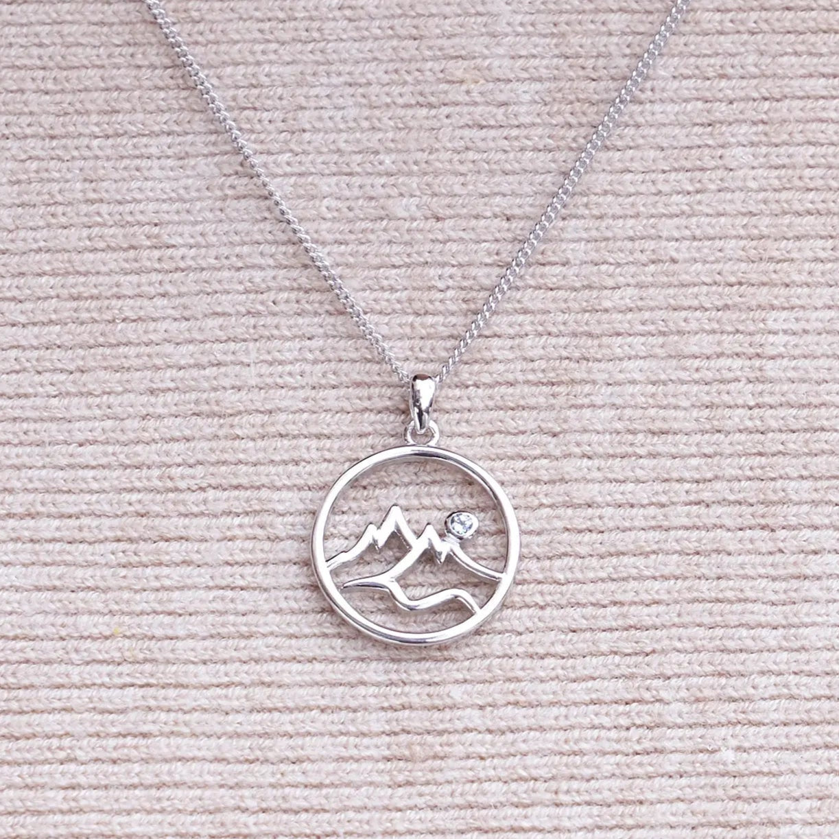 Circle Mountain Silhouette with Blue Topaz Accent Pendant - Park City Jewelers