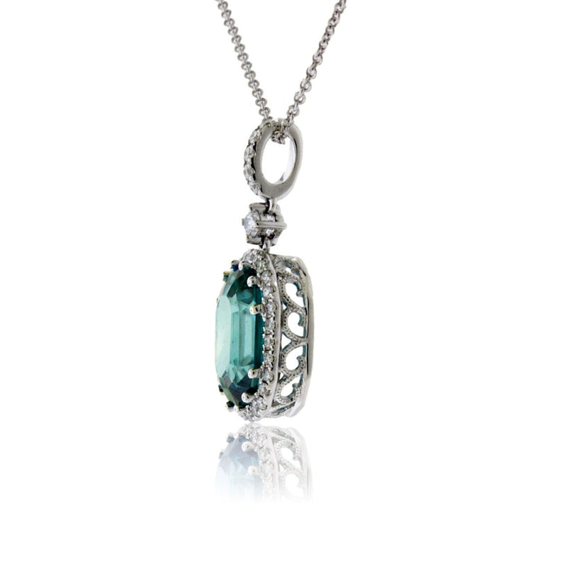 Oval Blue Zircon in Diamond Halo Pendant - Park City Jewelers