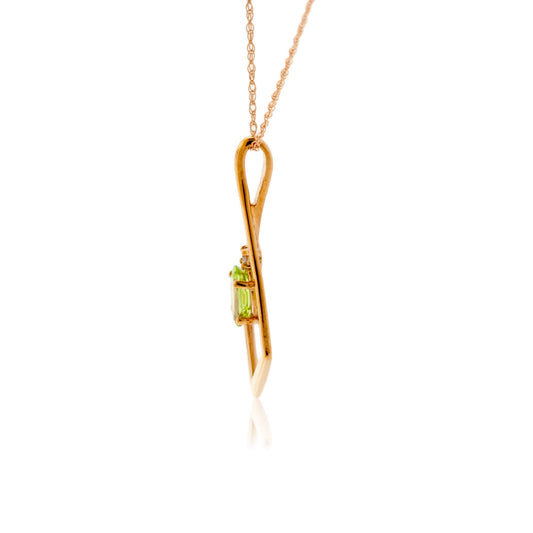 Oval Peridot and Geometric Halo Pendant - Park City Jewelers