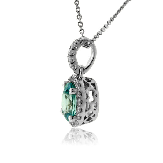 Simple Oval Blue Zircon in Diamond Halo Pendant - Park City Jewelers