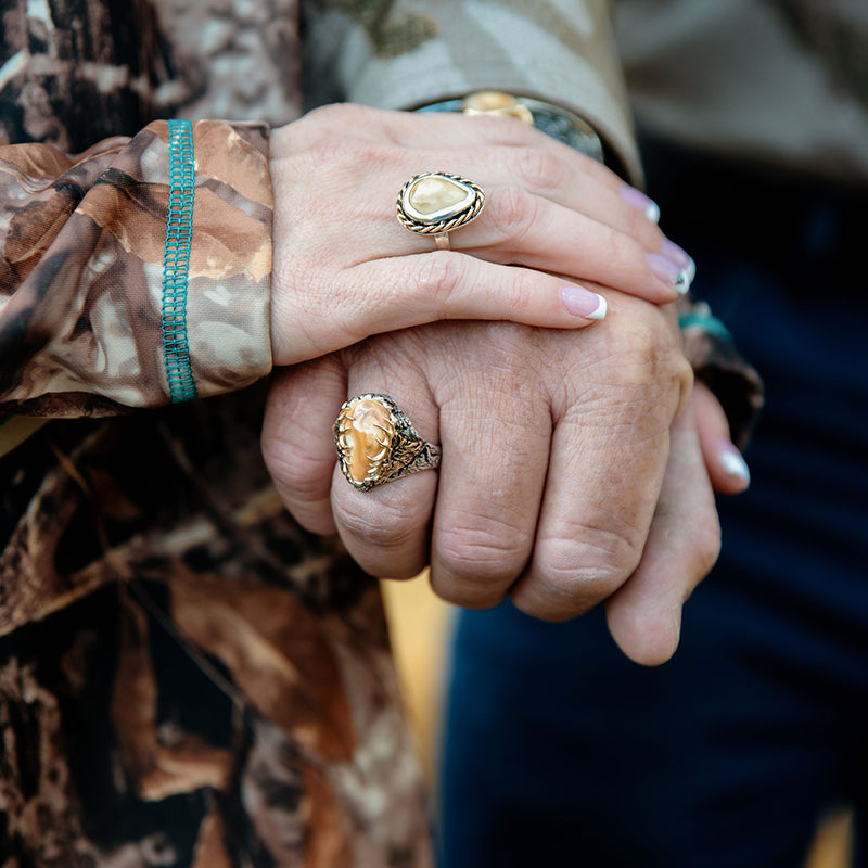 Man and Woman Each Wearing an Elk Ivory Ring from Park City Jewelers