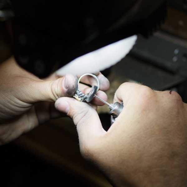 Jeweler Hand Polishing Ring - Park City Jewelers. 