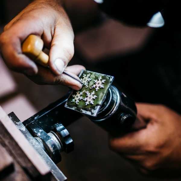 Jeweler Working on Custom Snowflake Jewelry - Park City Jewelers. 