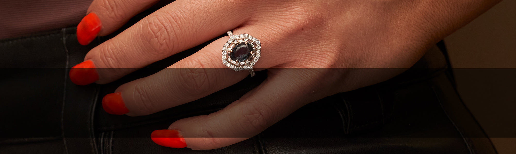 Woman Wearing Alexandrite Ring with a Diamond Halo from Park City Jewelers
