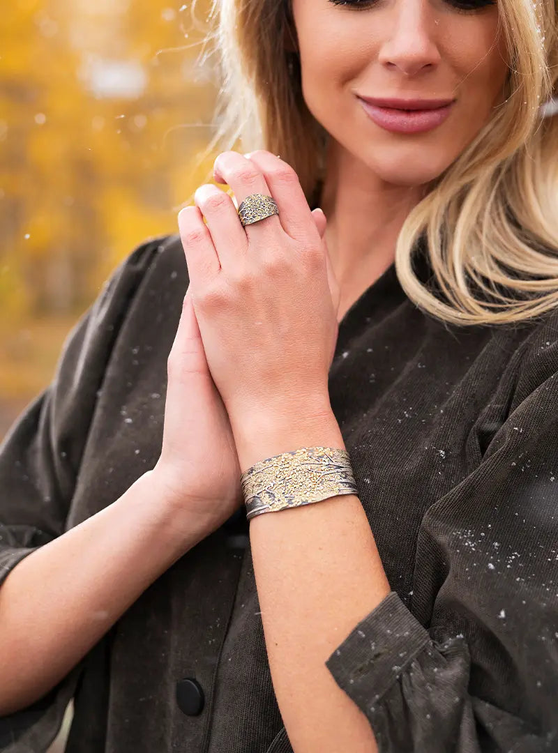 Woman Wearing a Gold Nugget Aspen Inspired Ring and Bracelet by Wolfgang Vaatz from Park City Jewelers