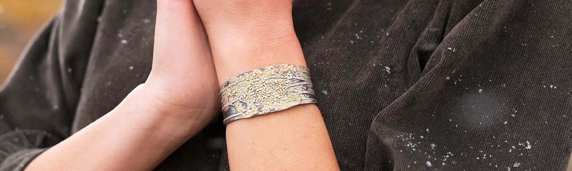 Woman Wearing Gold Nugget Bracelet by Wolfgang Vaatz from Park City Jewelers