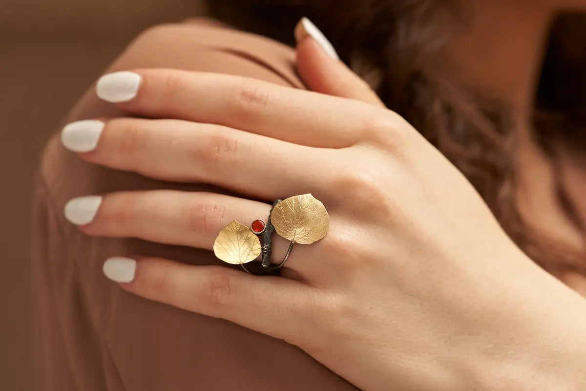 Woman Wearing Gold Aspen Leaf Ring by Wolfgang Vaatz from Park City Jewelers