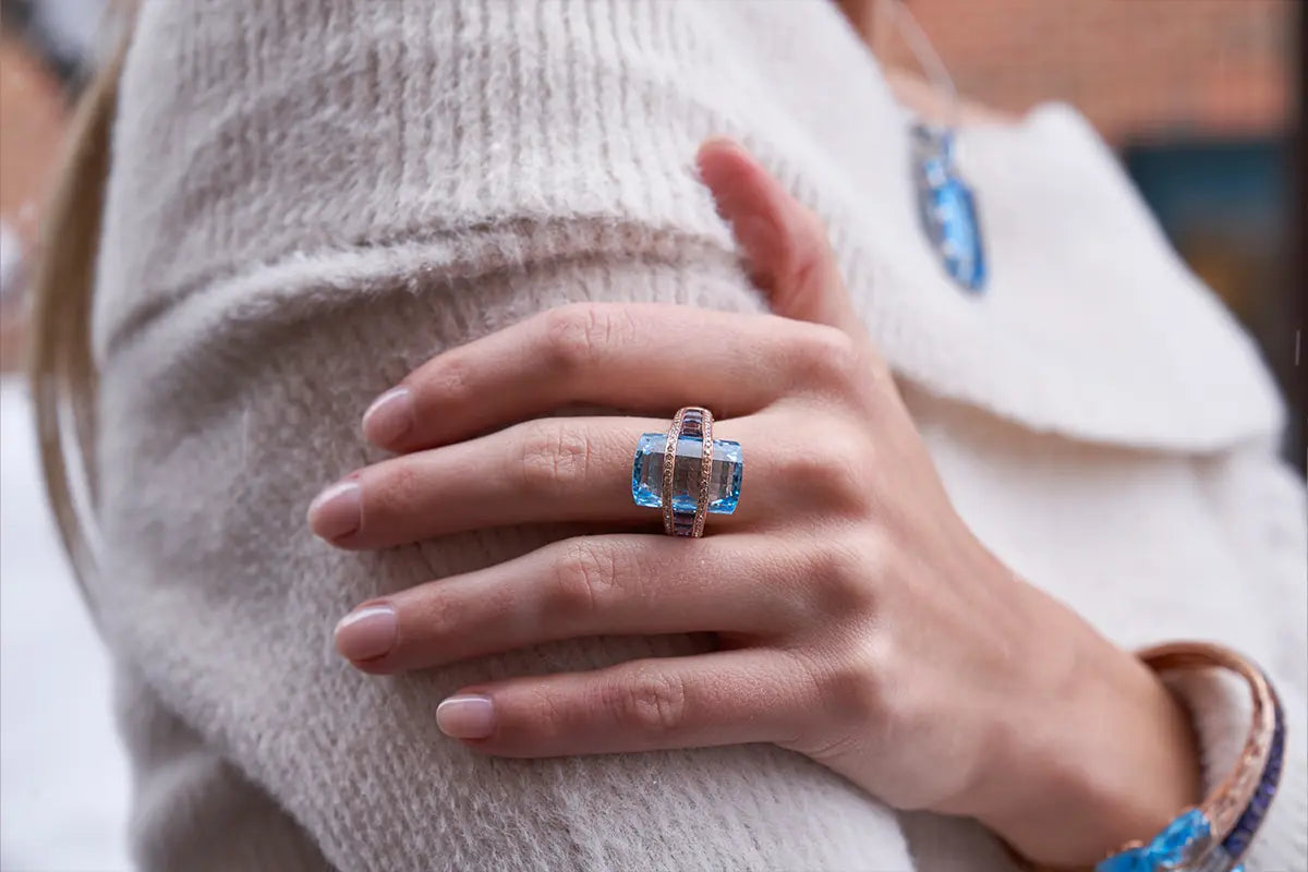 Woman Wearing Bellarri Iolite and Blue Topaz Ring from Park City Jewelers