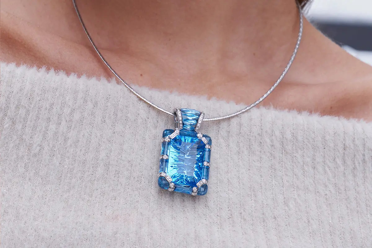 Woman Wearing Bellarri Blue Topaz Pendant