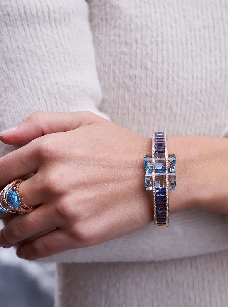 Woman Wearing Bellarri Blue Topaz and Iolite Bracelet by Park City Jewelers