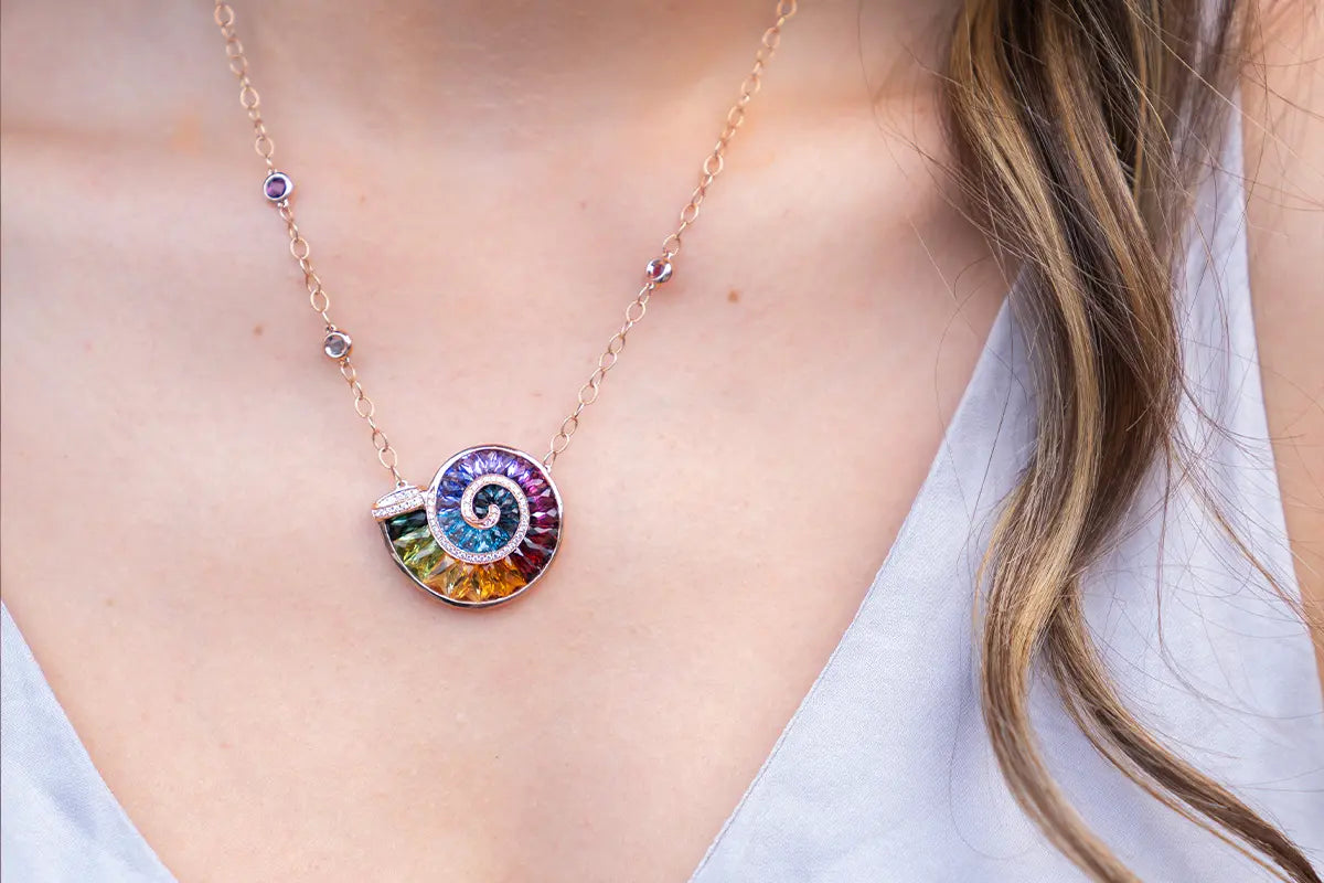 Woman Wearing Bellarri Rainbow Ammonite Pendant from Park City Jewelers