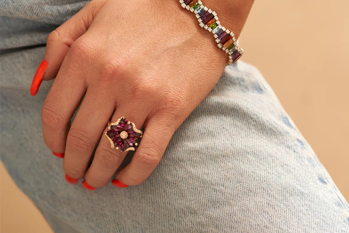 Woman Wearing Bellarri Garnet Flower Ring from Park City Jewelers