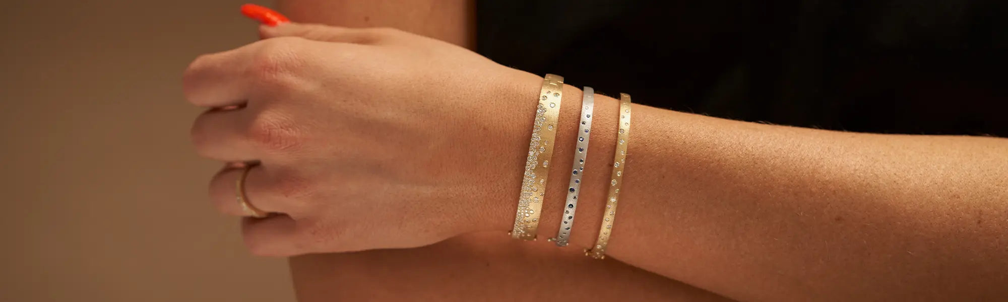 Woman Wearing Gold Confetti Bracelets from Park City Jewelers