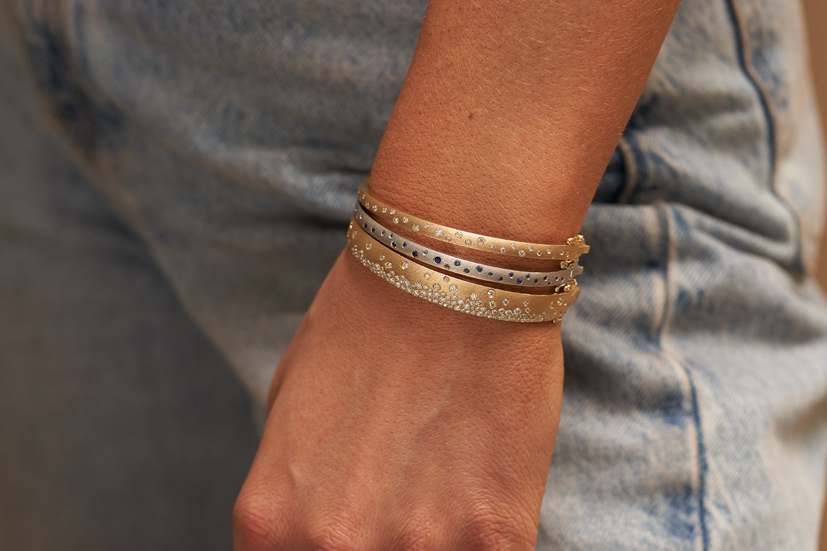 Woman Wearing Three Stacked Confetti Bracelets from Park City Jewelers