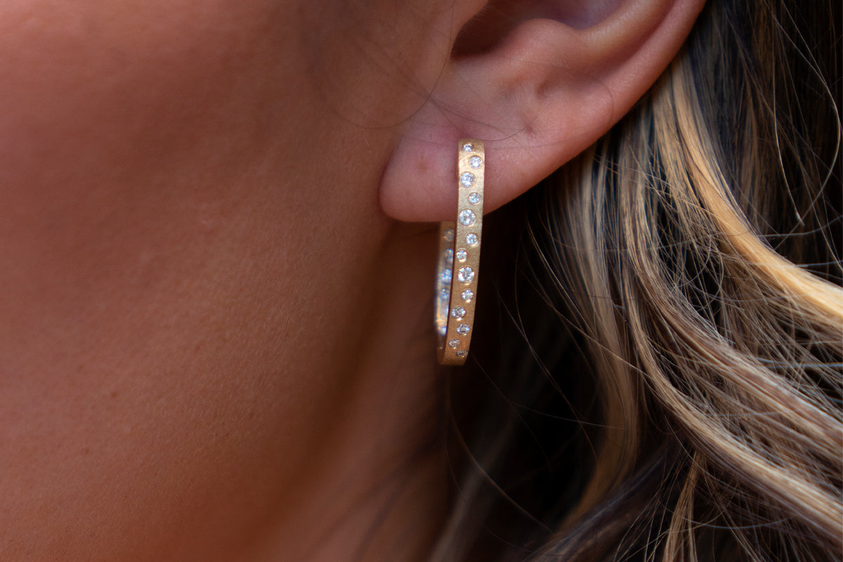 Woman Wearing Diamond Confetti Hoop Earrings from Park City Jewelers