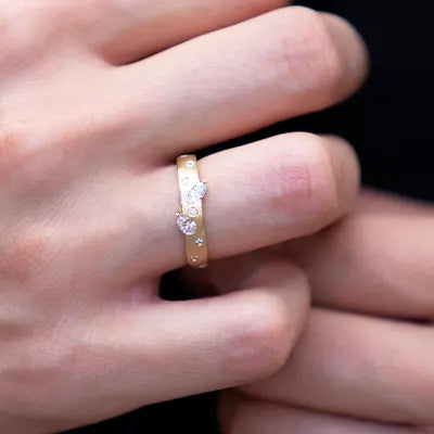 Woman Wearing a Gold Confetti Ring by Park City Jewelers