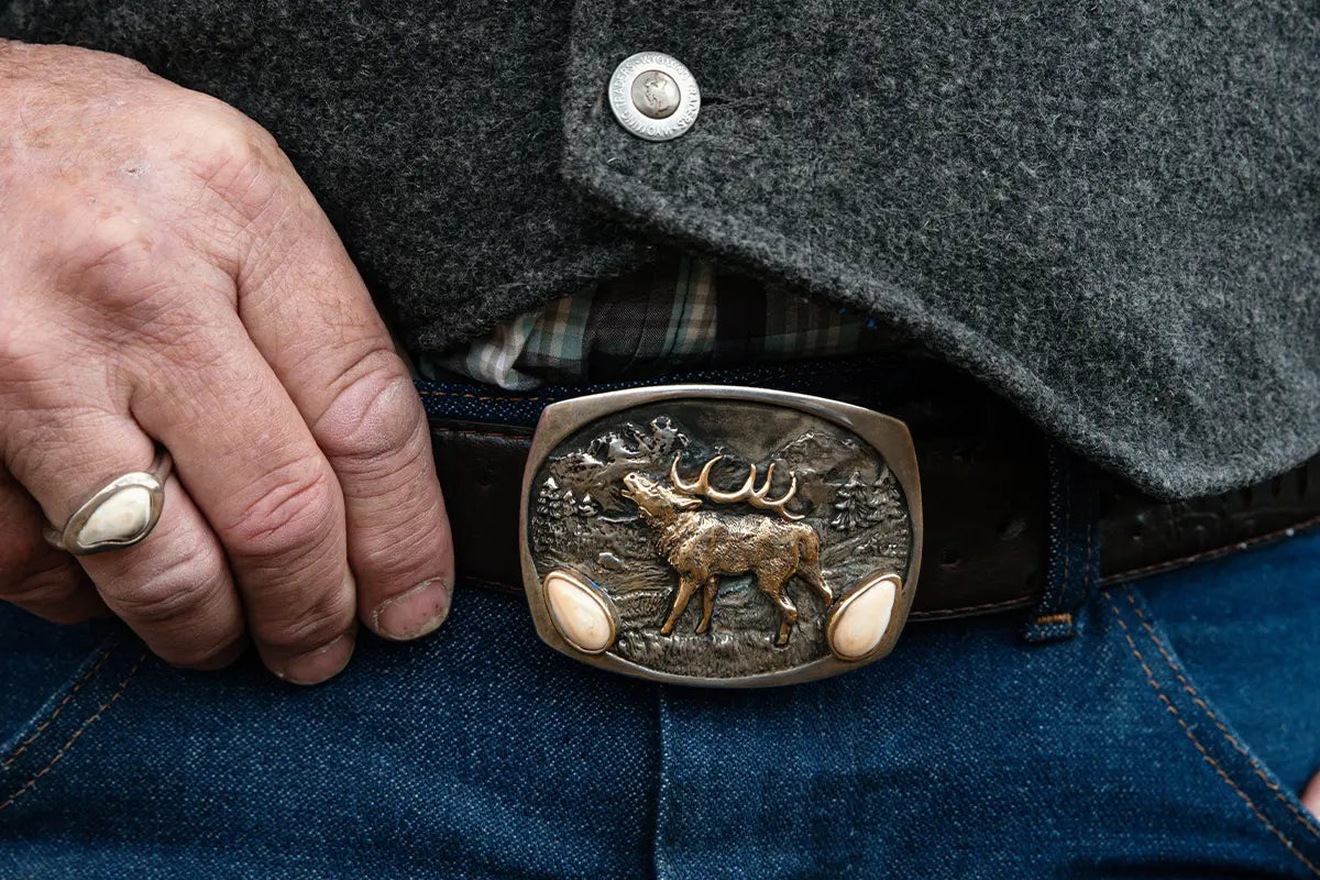 Man Wearing Elk Ivory Belt Buckle from Park City Jewelers