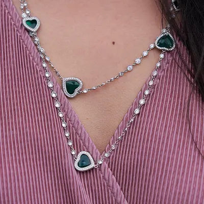 Woman Wearing Heart Shaped Emerald Necklace by Park City Jewelers