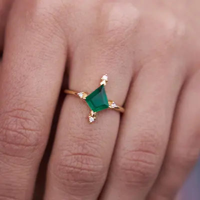 Woman Wearing a Kite Shaped Emerald Ring by Park City Jewelers