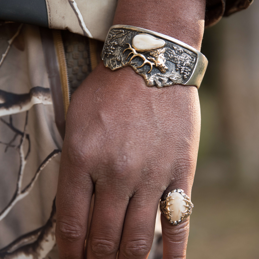Man wearing elk ivory ring and bracelet - Park City Jewelers. 