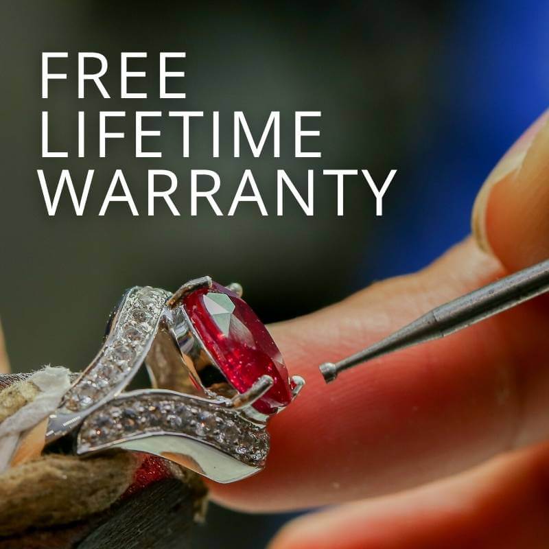 Free lifetime warranty image with a closeup of a ring and a jeweler working on it with a tool - Park City Jewelers. 