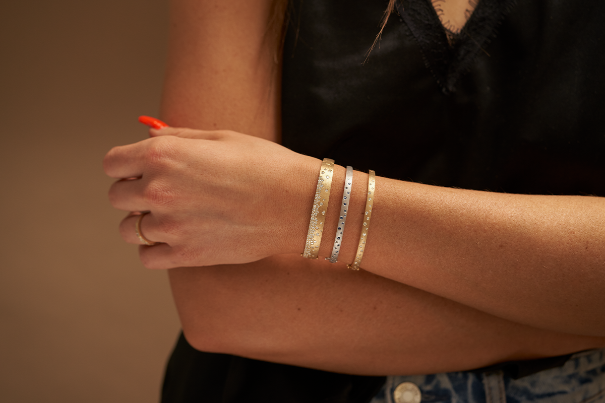 Woman Wearing Three Confetti Bracelets Stacked from Park City Jewelers